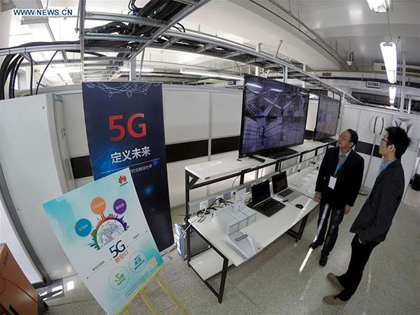 Staff members work at the 5G Innovation Lab in the China Academy of Telecommunication Research in Beijing, capital of China, Jan 7, 2016. (Photo/Xinhua) Staff members work at the 5G Innovation Lab in the China Academy of Telecommunication Research in Beijing, capital of China, Jan 7, 2016. (Photo/Xinhua)