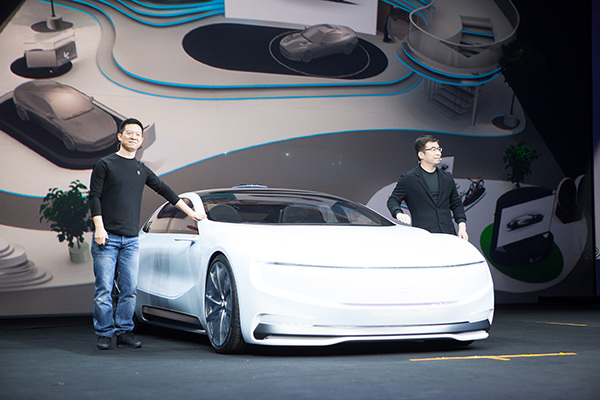 Jia Yueting(left), CEO of LeEco, and Ding Lei, LeSEE co-founder and global vice president, pose a picture with the company's first full-electronic automobile--LeSEE on April 20, 2016 during a product launch event held in Beijing. (Photo provided to chinadaily.com.cn) Jia Yueting(left), CEO of LeEco, and Ding Lei, LeSEE co-founder and global vice president, pose a picture with the company's first full-electronic automobile--LeSEE on April 20, 2016 during a product launch event held in Beijing. (Photo provided to chinadaily.com.cn)