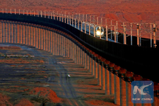 File photo taken on Nov. 24, 2015 shows a bullet train running on the Lanzhou-Xinjiang high-speed railway, in northwest China's Xinjiang Uygur Autonomous Region. (Photo: Xinhua/Cai Zengle) File photo taken on Nov. 24, 2015 shows a bullet train running on the Lanzhou-Xinjiang high-speed railway, in northwest China's Xinjiang Uygur Autonomous Region. (Photo: Xinhua/Cai Zengle)