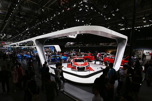 The exhibit booth for Audi attracts a large crowd of visitors at the Beijing auto show on Monday. Photos Provided to China Daily The exhibit booth for Audi attracts a large crowd of visitors at the Beijing auto show on Monday. Photos Provided to China Daily