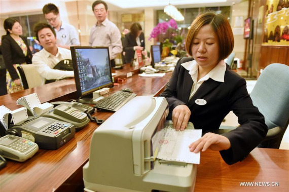 A staff member prepares a value-added tax (VAT) invoice for guest at Fuzhou Hotel in Fuzhou, capital of southeast China's Fujian Province, May 1, 2016. (Photo: Xinhua/Li Shanchuan) A staff member prepares a value-added tax (VAT) invoice for guest at Fuzhou Hotel in Fuzhou, capital of southeast China's Fujian Province, May 1, 2016. (Photo: Xinhua/Li Shanchuan)