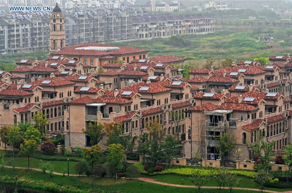 Photo taken on April 10, 2016 shows residential buildings in Huzhou City, east China's Zhejiang Province. According to data released by Zhejiang Provincial Bureau of Statistics, sales acreage and revenues of commodity houses in Zhejiang were 14.80 million square meters and 166.1 billion RMB yuan (about 25.5 billion U.S. dollars), 64 percent and 83 percent year on year respectively in the first quarter of 2016. (Xinhua/Tan Jin) Photo taken on April 10, 2016 shows residential buildings in Huzhou City, east China's Zhejiang Province. According to data released by Zhejiang Provincial Bureau of Statistics, sales acreage and revenues of commodity houses in Zhejiang were 14.80 million square meters and 166.1 billion RMB yuan (about 25.5 billion U.S. dollars), 64 percent and 83 percent year on year respectively in the first quarter of 2016. (Xinhua/Tan Jin)