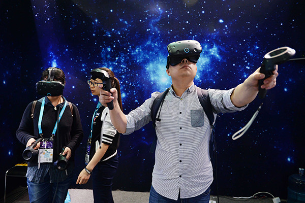 A visitor plays VR games at the three-day Consumer Electronics Show Asia 2016 in Shanghai, which ends on Friday. The event showcases the latest VR products including headsets, glasses and accompanying content displayers.(Photo provided to China Daily) A visitor plays VR games at the three-day Consumer Electronics Show Asia 2016 in Shanghai, which ends on Friday. The event showcases the latest VR products including headsets, glasses and accompanying content displayers.(Photo provided to China Daily)