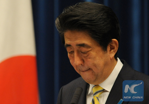 Japanese Prime Minister Shinzo Abe bites his lips during a press conference at his official residence in Tokyo, Japan, Nov. 21, 2014. (Photo: Xinhua/Stringer) Japanese Prime Minister Shinzo Abe bites his lips during a press conference at his official residence in Tokyo, Japan, Nov. 21, 2014. (Photo: Xinhua/Stringer)