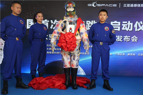 Professional parachutists Wang Desong, He Yufeng and Qi Yao (from left to right) unveil China's first ever space parachuting suit on May 19, 2016 in Beijing. Professional parachutists Wang Desong, He Yufeng and Qi Yao (from left to right) unveil China's first ever space parachuting suit on May 19, 2016 in Beijing.