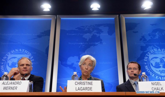 The International Monetary Fund(IMF) Managing Director Christine Lagarde (C) speaks at a press conference in Washington D.C., the United States, on June 22, 2016. (Xinhua/Yin Bogu) The International Monetary Fund(IMF) Managing Director Christine Lagarde (C) speaks at a press conference in Washington D.C., the United States, on June 22, 2016. (Xinhua/Yin Bogu)
