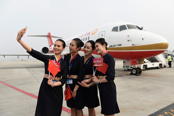 Flight attendants of Chengdu Airlines take a photo in front of the regional jet ARJ21-700 at Chengdu Shuangliu International Airport in Southwest China's Sichuan province on June 28, 2016. (Photo/Xinhua) Flight attendants of Chengdu Airlines take a photo in front of the regional jet ARJ21-700 at Chengdu Shuangliu International Airport in Southwest China's Sichuan province on June 28, 2016. (Photo/Xinhua)