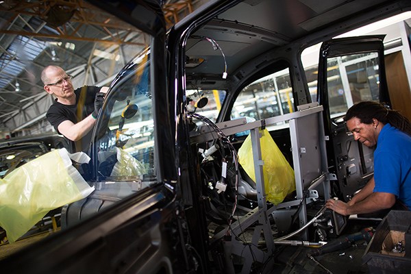 Employees work on black TX4 Euro 5 London taxi cabs as they move along the production line at the London Taxi Company's assembly plant, a unit of Zhejiang Geely Holding Co, in Coventry, UK, in March, 2014. (Photo provided to China Daily) Employees work on black TX4 Euro 5 London taxi cabs as they move along the production line at the London Taxi Company's assembly plant, a unit of Zhejiang Geely Holding Co, in Coventry, UK, in March, 2014. (Photo provided to China Daily)
