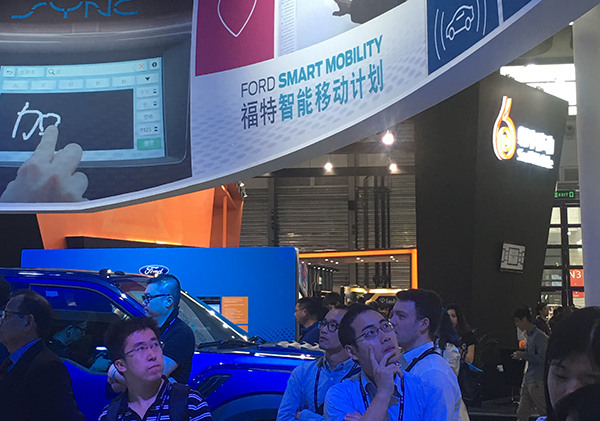 Visitors at the Ford exhibition area at the 2016 Mobile World Congress Shanghai that ran from June 29 to July 1. (Li Fusheng/China Daily) Visitors at the Ford exhibition area at the 2016 Mobile World Congress Shanghai that ran from June 29 to July 1. (Li Fusheng/China Daily)