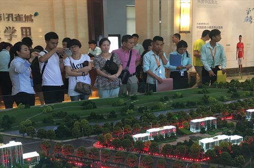 Prospective buyers look at a model of a residential real estate project on Saturday at the Guangyang Economic Development Zone in Langfang, North China's Hebei Province. (Photo: Li Xuanmin/GT) Prospective buyers look at a model of a residential real estate project on Saturday at the Guangyang Economic Development Zone in Langfang, North China's Hebei Province. (Photo: Li Xuanmin/GT)
