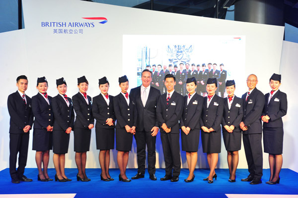 Chinese cabin crew poses with Richard Tams, British Airways' executive vice president for China, at the airline's crew base in Beijing. (Photo provided to China Daily) Chinese cabin crew poses with Richard Tams, British Airways' executive vice president for China, at the airline's crew base in Beijing. (Photo provided to China Daily)