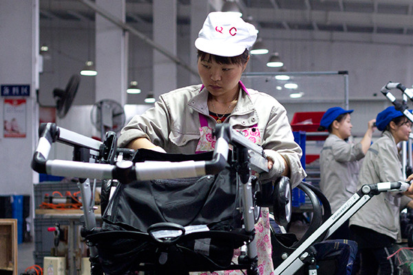 An employee of Goodbaby Group assembles baby strollers in the company's plant in Kunshan, Jiangsu province. (Photo/China Daily) An employee of Goodbaby Group assembles baby strollers in the company's plant in Kunshan, Jiangsu province. (Photo/China Daily)