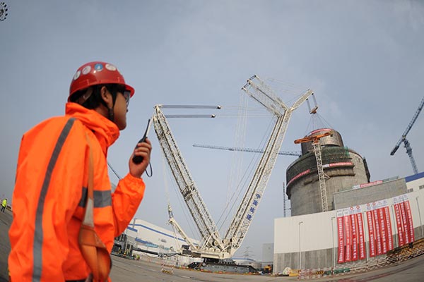 A worker monitors a construction site at Haiyang nuclear power plant in Shandong province. TANG KE / FOR CHINA DAILY A worker monitors a construction site at Haiyang nuclear power plant in Shandong province. TANG KE / FOR CHINA DAILY