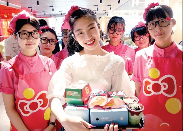 A girl holds a tray of Hello Kitty-themed food products at a McDonald's restaurant in downtown Beijing. JIANG DONG/CHINA DAILY A girl holds a tray of Hello Kitty-themed food products at a McDonald's restaurant in downtown Beijing. JIANG DONG/CHINA DAILY