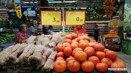 Residents shop at a supermarket in Shenyang, northeast China's Liaoning Province, Aug. 8. 2016. China's consumer price index (CPI), a main gauge of inflation, grew 1.8 percent year on year in July, according to the National Bureau of Statistics. (Xinhua/Long Lei) Residents shop at a supermarket in Shenyang, northeast China's Liaoning Province, Aug. 8. 2016. China's consumer price index (CPI), a main gauge of inflation, grew 1.8 percent year on year in July, according to the National Bureau of Statistics. (Xinhua/Long Lei)