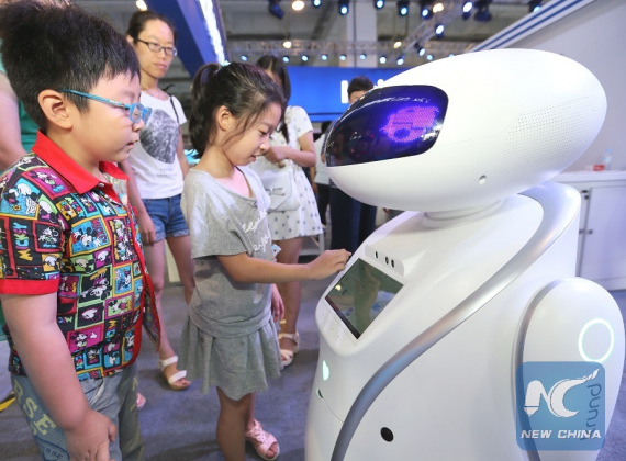 Children interact with a robot during an innovation, entrepreneurship and makers' achievement exhibition in Qingdao, east China's Shandong Province, July 31, 2016.(Xinhua/Liang Xiaopeng) Children interact with a robot during an innovation, entrepreneurship and makers' achievement exhibition in Qingdao, east China's Shandong Province, July 31, 2016.(Xinhua/Liang Xiaopeng)