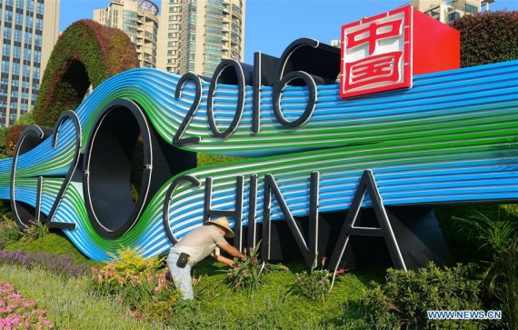 A gardener maintains a G20 themed flower terrace at Jiangnan Avenue in Binjiang District of Hangzhou, capital of east China's Zhejiang Province, Aug. 25, 2016. The G20 Summit will be held in Hangzhou on Sept. 4 to 5. (Xinhua/Yin Dongxun) A gardener maintains a G20 themed flower terrace at Jiangnan Avenue in Binjiang District of Hangzhou, capital of east China's Zhejiang Province, Aug. 25, 2016. The G20 Summit will be held in Hangzhou on Sept. 4 to 5. (Xinhua/Yin Dongxun)