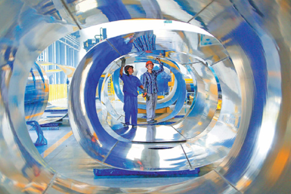 Workers check the steel tanks used to produce a special type of tanker in Tianming Special Vehicle Manufacturing Company, which mainly exports to the Middle East, South America and Africa, in Tuowang Port Industry Zone in Lianyungang, east China's Jiangsu province in June. The competitive manufacturing industry remains a pillar of the Chinese economy. (Photo/China Daily) Workers check the steel tanks used to produce a special type of tanker in Tianming Special Vehicle Manufacturing Company, which mainly exports to the Middle East, South America and Africa, in Tuowang Port Industry Zone in Lianyungang, east China's Jiangsu province in June. The competitive manufacturing industry remains a pillar of the Chinese economy. (Photo/China Daily)