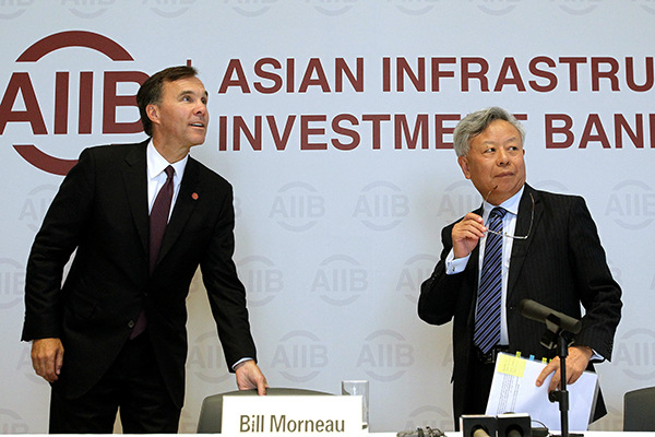 Jin Liqun, president of the Asian Infrastructure Investment Bank, and Canadian Finance Minister Bill Morneau attend a news conference in Beijing on Wednesday. (Photo/China Daily) Jin Liqun, president of the Asian Infrastructure Investment Bank, and Canadian Finance Minister Bill Morneau attend a news conference in Beijing on Wednesday. (Photo/China Daily)
