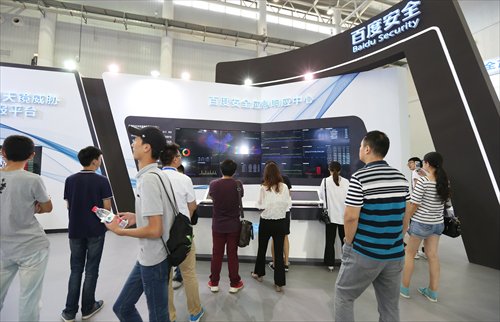 Visitors watch a screen which shows Baidu is monitoring the Internet safety of enterprises and conducting regular defense processes at the cyber security exhibition on Tuesday. (Photo: Cao Siqi/GT) Visitors watch a screen which shows Baidu is monitoring the Internet safety of enterprises and conducting regular defense processes at the cyber security exhibition on Tuesday. (Photo: Cao Siqi/GT)
