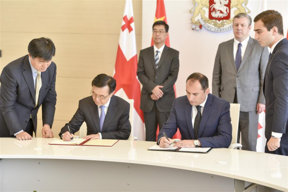 Chinese Commerce Minster Gao Hucheng (2nd L, front) and Georgian Vice Prime Minister and Minister of Economy and Sustainable Development Dimitry Kumsishvili (2nd R, front) sign on the memorandum of understanding in Tbilisi, Georgia, Oct. 5, 2016. China and Georgia on Wednesday substantially concluded their Free Trade Agreement (FTA) negotiations, with a landmark memorandum of understanding signed in Tbilisi. (Xinhua/Giorgi Induashvili) Chinese Commerce Minster Gao Hucheng (2nd L, front) and Georgian Vice Prime Minister and Minister of Economy and Sustainable Development Dimitry Kumsishvili (2nd R, front) sign on the memorandum of understanding in Tbilisi, Georgia, Oct. 5, 2016. China and Georgia on Wednesday substantially concluded their Free Trade Agreement (FTA) negotiations, with a landmark memorandum of understanding signed in Tbilisi. (Xinhua/Giorgi Induashvili)
