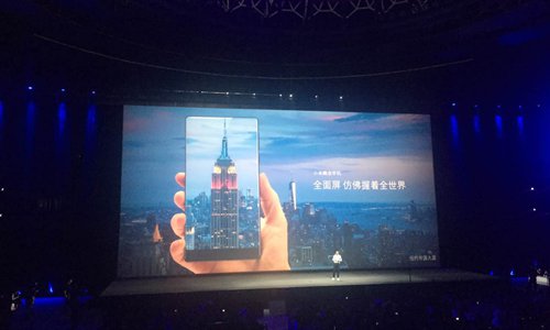 Xiaomi CEO Lei Jun introduces 6.4-inch phablet MIX with a 91.3 percent screen-to-body ratio at a press conference held in Beijing on Tuesday. (Photo: Zhang Ye/GT) Xiaomi CEO Lei Jun introduces 6.4-inch phablet MIX with a 91.3 percent screen-to-body ratio at a press conference held in Beijing on Tuesday. (Photo: Zhang Ye/GT)