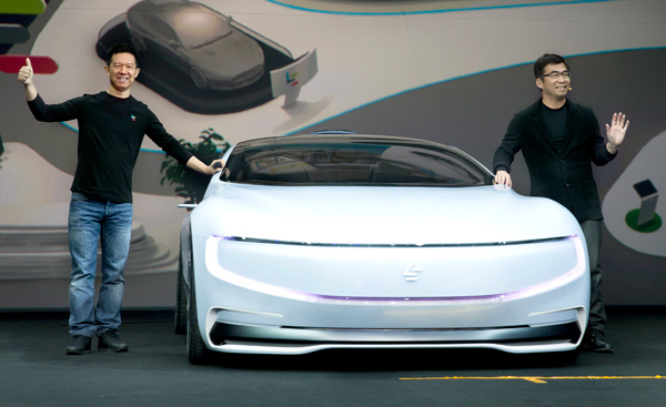 Jia Yueting (left), CEO of LeEco, introduces the company's first concept electric car LeSEE in April. PROVIDED TO CHINA DAILY Jia Yueting (left), CEO of LeEco, introduces the company's first concept electric car LeSEE in April. PROVIDED TO CHINA DAILY