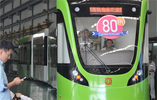 Two engineers conduct a test on a new tram just off the production line at the CRRC Zhuzhou Locomotive Co Ltd. (Long Hongtao / Xinhua) Two engineers conduct a test on a new tram just off the production line at the CRRC Zhuzhou Locomotive Co Ltd. (Long Hongtao / Xinhua)