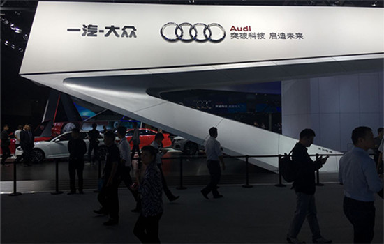 Visitors pass by FAW-Volkswagen Audi's booth at the Guangzhou auto show in November 2016. (Photo/China Daily) Visitors pass by FAW-Volkswagen Audi's booth at the Guangzhou auto show in November 2016. (Photo/China Daily)