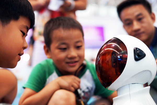 A smart home robot called Xiaozhi (Little Smart) on display at an expo in Tianjin receives visitors' attention. LI SHENGLI / FOR CHINA DAILY A smart home robot called Xiaozhi (Little Smart) on display at an expo in Tianjin receives visitors' attention. LI SHENGLI / FOR CHINA DAILY