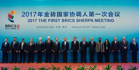 State Councilor Yang Jiechi (eighth from left) and representatives of BRICS countries pose on Thursday at the opening ceremony of the year's first BRICS Sherpa meeting in Nanjing, Jiangsu province. Yang urged BRICS nations to work together to raise the voices of developing countries in global affairs. (Xinhua/Li Xiang) State Councilor Yang Jiechi (eighth from left) and representatives of BRICS countries pose on Thursday at the opening ceremony of the year's first BRICS Sherpa meeting in Nanjing, Jiangsu province. Yang urged BRICS nations to work together to raise the voices of developing countries in global affairs. (Xinhua/Li Xiang)