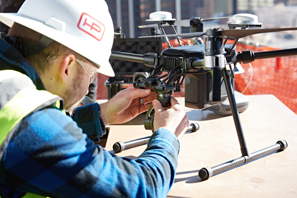 A man adjusts lenses of a Matrice 200 drone. PROVIDED TO CHINA DAILY A man adjusts lenses of a Matrice 200 drone. PROVIDED TO CHINA DAILY
