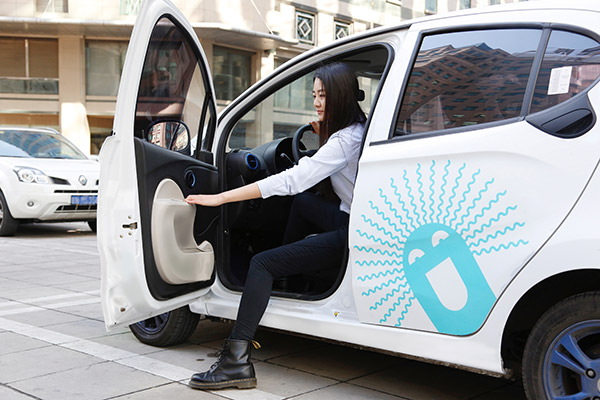 A woman is about to test-drive a new energy car provided by Gofun, the car-sharing arm of Beijing Shouqi Group. (Photo provided to China Daily) A woman is about to test-drive a new energy car provided by Gofun, the car-sharing arm of Beijing Shouqi Group. (Photo provided to China Daily)