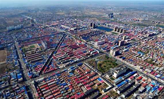 Aerial photo taken on April 1, 2017 shows Xiongxian County, north China's Hebei Province. China announced Saturday it would establish the Xiongan New Area in Hebei Province, as part of measures to advance the coordinated development of the Beijing-Tianjin-Hebei (BTH) region. The New Area, about 100 km southwest of downtown Beijing, will span three counties that sit at the center of the triangular area formed by Beijing, Tianjin and Hebei's provincial capital Shijiazhuang. (Xinhua/Wang Xiao) Aerial photo taken on April 1, 2017 shows Xiongxian County, north China's Hebei Province. China announced Saturday it would establish the Xiongan New Area in Hebei Province, as part of measures to advance the coordinated development of the Beijing-Tianjin-Hebei (BTH) region. The New Area, about 100 km southwest of downtown Beijing, will span three counties that sit at the center of the triangular area formed by Beijing, Tianjin and Hebei's provincial capital Shijiazhuang. (Xinhua/Wang Xiao)