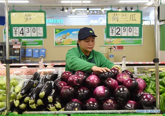 A saleswoman arranges vegetables at a supermarket in Hejian City, north China's Hebei Province, April 12, 2017. China's consumer price index (CPI), a main gauge of inflation, grew 0.9 percent year on year in March, the National Bureau of Statistics announced on April 12. (Xinhua/Zhu Xudong) A saleswoman arranges vegetables at a supermarket in Hejian City, north China's Hebei Province, April 12, 2017. China's consumer price index (CPI), a main gauge of inflation, grew 0.9 percent year on year in March, the National Bureau of Statistics announced on April 12. (Xinhua/Zhu Xudong)