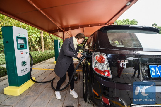 A driver charges the electric car at the Nanxun ancient town in Huzhou City, east China's Zhejiang Province, Nov. 10, 2016. Huzhou built electric vehicle chargers in some scenic areas to promote electric car. (Xinhua/Xu Yu) A driver charges the electric car at the Nanxun ancient town in Huzhou City, east China's Zhejiang Province, Nov. 10, 2016. Huzhou built electric vehicle chargers in some scenic areas to promote electric car. (Xinhua/Xu Yu)