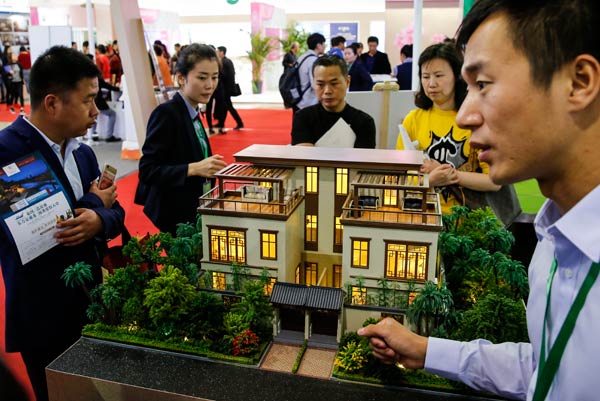 Potential property buyers visit the spring home fair in Beijing on Friday. (Photo by Kuang Linhua/China Daily) Potential property buyers visit the spring home fair in Beijing on Friday. (Photo by Kuang Linhua/China Daily)