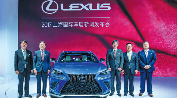 Lexus executives pose with the new Lexus NX mid-size SUV at its world premiere during the Shanghai Auto Show on April 19, 2017. (Photo provided to China Daily) Lexus executives pose with the new Lexus NX mid-size SUV at its world premiere during the Shanghai Auto Show on April 19, 2017. (Photo provided to China Daily)