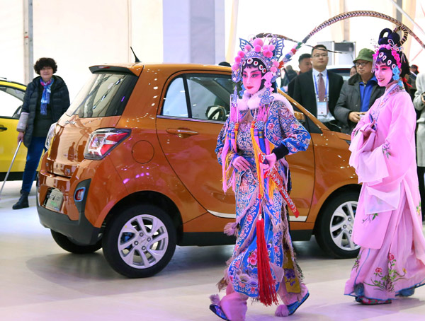 Performers in traditional local opera costumes attend a new energy vehicle show in Jinhua, Zhejiang province. (Photo by Ge Yuejin/For China Daily) Performers in traditional local opera costumes attend a new energy vehicle show in Jinhua, Zhejiang province. (Photo by Ge Yuejin/For China Daily)