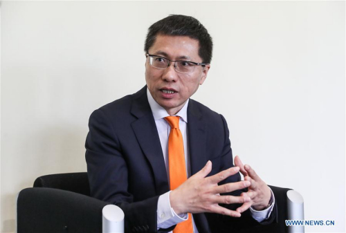 The vice president of Midea Group, a Chinese electrical appliances manufacturer, Andy Gu, now also the chairman of KUKA's supervisory board, is interviewed with Xinhua News Agency during the Hanover Messe 2017 in Hanover, Germany, on April 25, 2017. (Xinhua/Shan Yuqi)