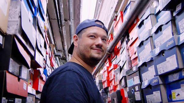 John McPheters, Stadium Goods' co-founder and CEO, at a storehouse of KAWS X Air Jordan 4 sneakers. This New York City-based sneaker startup launched a flagship store on Tmall Global in 2016. PROVIDED TO CHINA DAILY John McPheters, Stadium Goods' co-founder and CEO, at a storehouse of KAWS X Air Jordan 4 sneakers. This New York City-based sneaker startup launched a flagship store on Tmall Global in 2016. PROVIDED TO CHINA DAILY