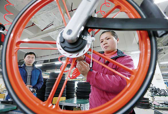 Workers at a production line of Mobike in Hengyang, Hunan province, inspect bicycles one last time before releasing them for shared use in cities. Peng Bin / For China Daily Workers at a production line of Mobike in Hengyang, Hunan province, inspect bicycles one last time before releasing them for shared use in cities. Peng Bin / For China Daily
