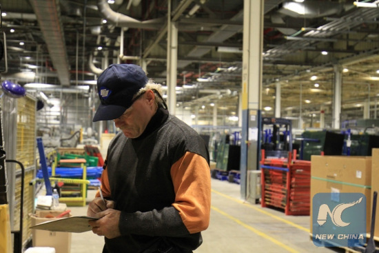 A worker records data at Fuyao Glass America's new facility in Moraine, Ohio, the United States on Oct. 7, 2016. Fuyao Glass America is part of Fuyao Industry Group Co. Ltd., a leading international manufacturer of automotive and industrial glass located in China.(Xinhua/Wang Naishui) A worker records data at Fuyao Glass America's new facility in Moraine, Ohio, the United States on Oct. 7, 2016. Fuyao Glass America is part of Fuyao Industry Group Co. Ltd., a leading international manufacturer of automotive and industrial glass located in China.(Xinhua/Wang Naishui)
