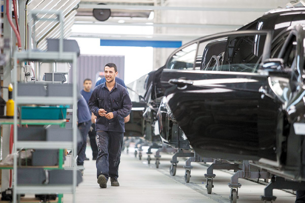 Workers check auto parts at Geely's plant in Montevideo, Uruguay. XU ZIJIAN / XINHUA Workers check auto parts at Geely's plant in Montevideo, Uruguay. XU ZIJIAN / XINHUA