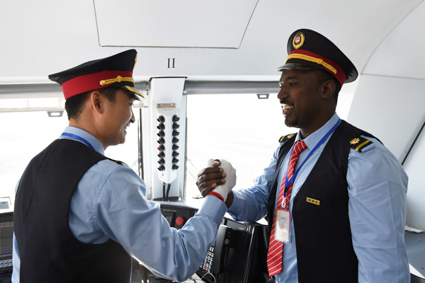 Chinese and Ethiopian train drivers shake hands, celebrating a railway station operational in Addis Ababa. (Photo/Xinhua) Chinese and Ethiopian train drivers shake hands, celebrating a railway station operational in Addis Ababa. (Photo/Xinhua)