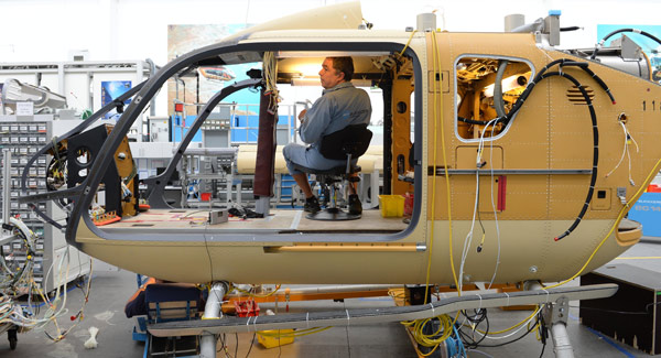 An employee works at the production line of the Airbus helicopter plant in Donauwoerth, Germany. The European aircraft maker is to manufacture the H135 light twin-engine helicopters in China. (Photo provided to China Daily) An employee works at the production line of the Airbus helicopter plant in Donauwoerth, Germany. The European aircraft maker is to manufacture the H135 light twin-engine helicopters in China. (Photo provided to China Daily)