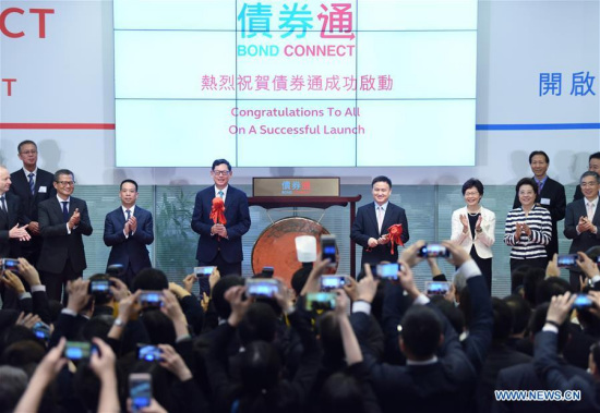 Participants attend a ceremony held by Hong Kong Exchanges and Clearing Limited to launch the northbound mainland-Hong Kong bond connect in Hong Kong, south China, July 3, 2017. (Xinhua/Wang Shen) Participants attend a ceremony held by Hong Kong Exchanges and Clearing Limited to launch the northbound mainland-Hong Kong bond connect in Hong Kong, south China, July 3, 2017. (Xinhua/Wang Shen)