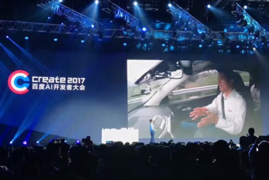 Robin Li interacts with crowd at Baidu Create 2017 AI developer conference at National Convention Center from the self-driving car on Wednesday. (Photo/Beijing Youth Daily) Robin Li interacts with crowd at Baidu Create 2017 AI developer conference at National Convention Center from the self-driving car on Wednesday. (Photo/Beijing Youth Daily)