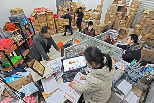 Employees of an online store process orders in Qingyanliu village, East China's Zhejiang province on Dec 29, 2015. (Photo/Xinhua) Employees of an online store process orders in Qingyanliu village, East China's Zhejiang province on Dec 29, 2015. (Photo/Xinhua)