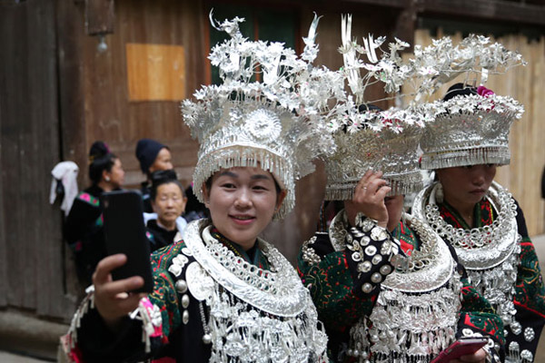 Locals pose for a photo before welcoming participants at the Conference for the Revival of Chinese Villages in Taijiang county, Southwest China's Guizhou province, on June 16. (Photo by Hou Liqiang/chinadaily.com.cn) Locals pose for a photo before welcoming participants at the Conference for the Revival of Chinese Villages in Taijiang county, Southwest China's Guizhou province, on June 16. (Photo by Hou Liqiang/chinadaily.com.cn)